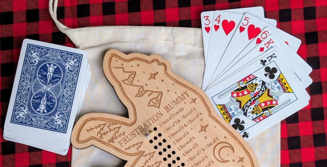 A wooden bear frustration rummy board set up with playing cards