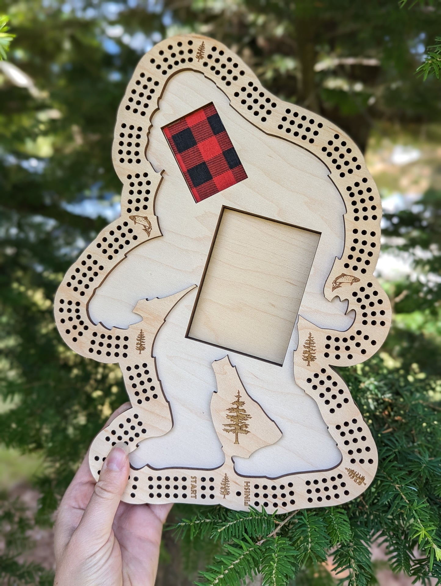 Space for storing cards and pegs underneath the sasquatch