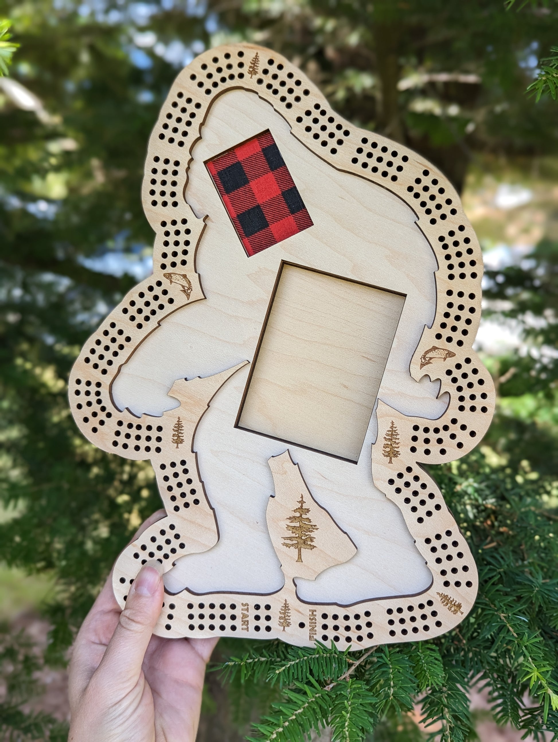 Space for storing cards and pegs underneath the sasquatch
